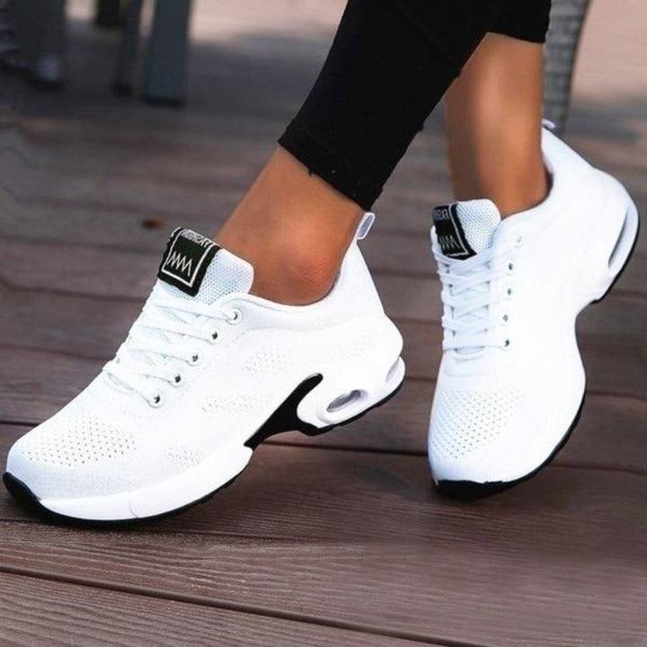 Side view of comfortable orthopedic sneakers with shock-absorbing gel sole for women