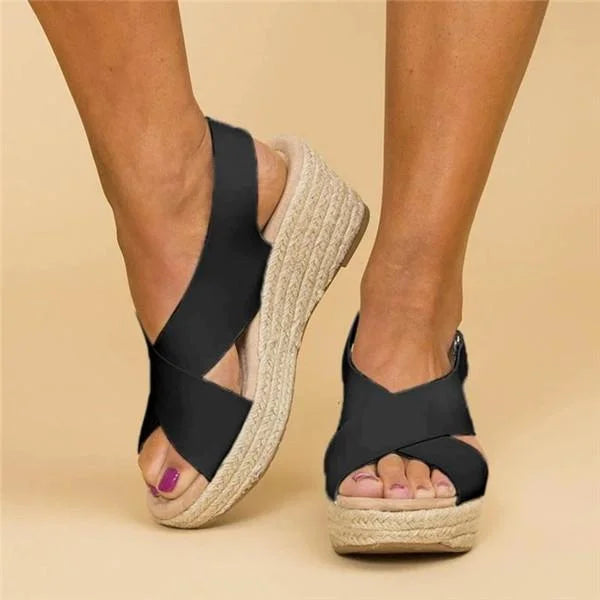 Close-up of comfortable orthopedic sandals featuring woven jute wedge heel