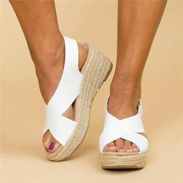 Model wearing stylish black wedge espadrilles with orthopedic comfort
