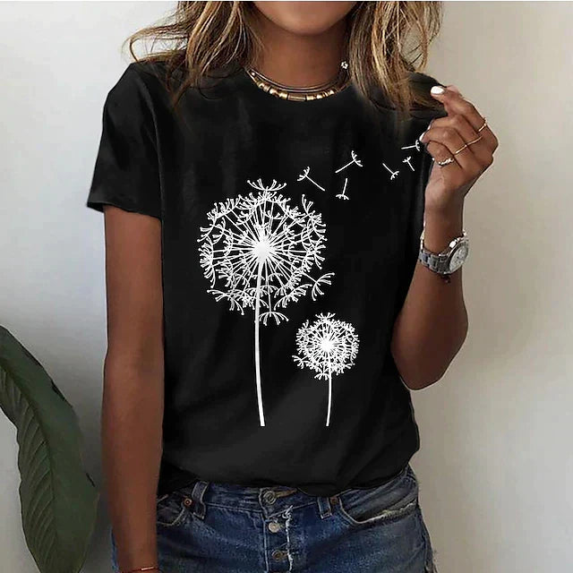 Woman wearing a black short sleeve t-shirt with a white dandelion print