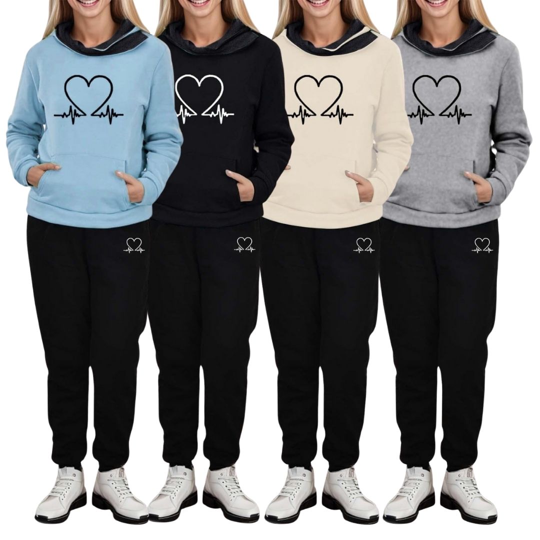 Four women wearing matching two-piece tracksuits in light blue, black, beige, and grey with heart graphics.