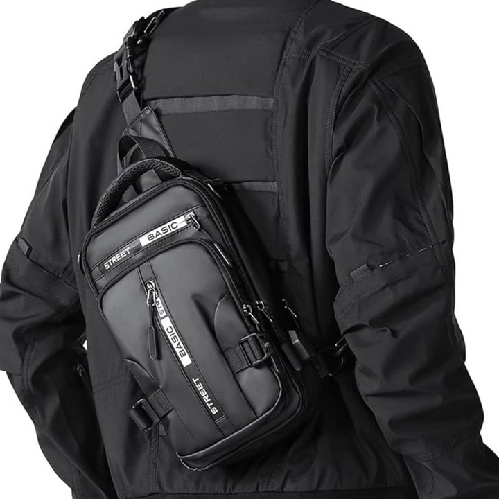 Person wearing a black compact crossbody sling backpack outdoors