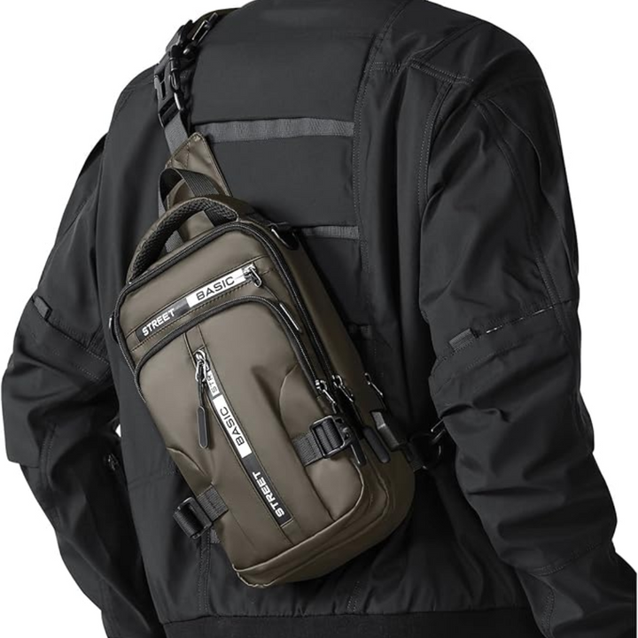Person wearing an olive green compact crossbody sling backpack