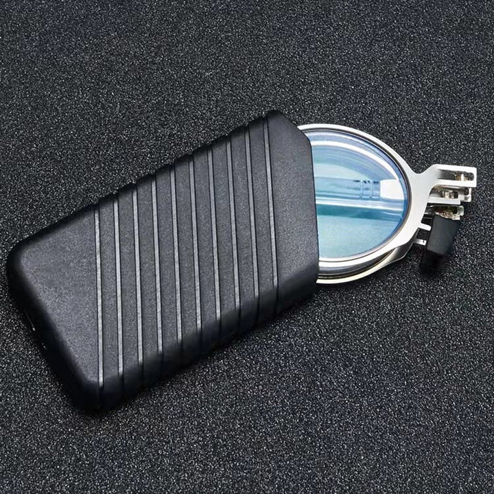 Compact folding reading glasses partially tucked inside a hard protective case