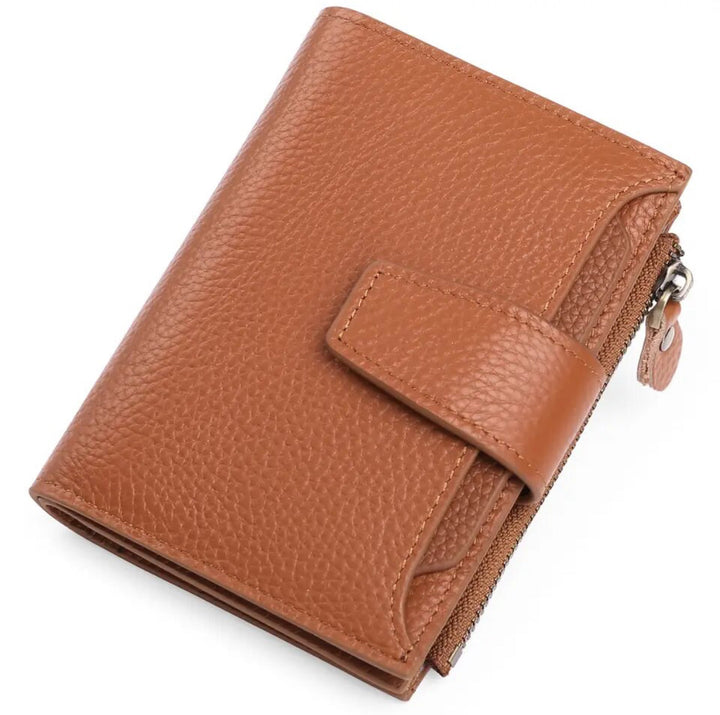 Womens compact wallet held in hand to illustrate small portable size