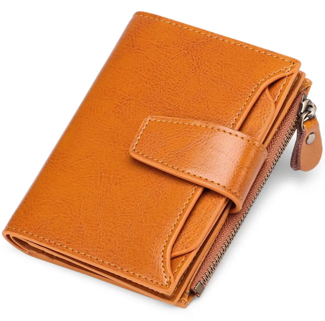 Womens rfid blocking compact wallet next to credit cards for scale comparison