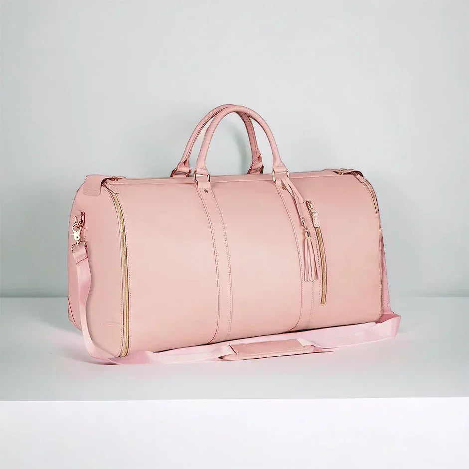 Studio shot of the pink travel garment duffel bag showing side zippers