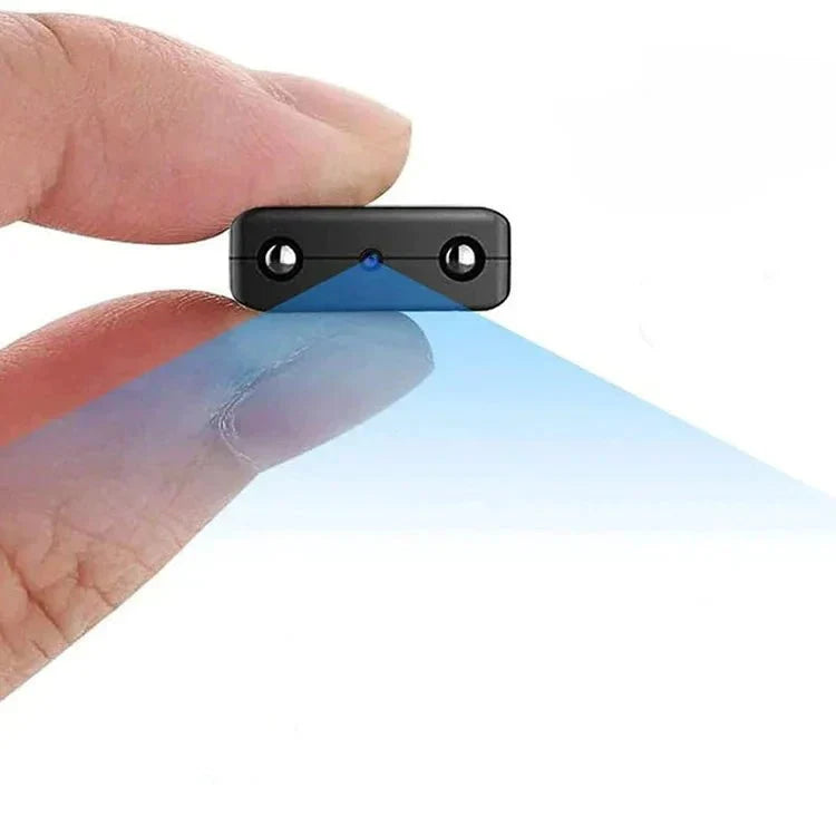 Compact mini HD WiFi security camera held between fingers showing its tiny size