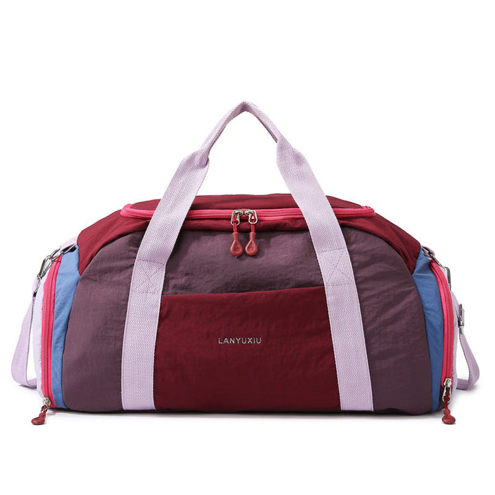 Burgundy compact sports duffle bag with dual carrying straps