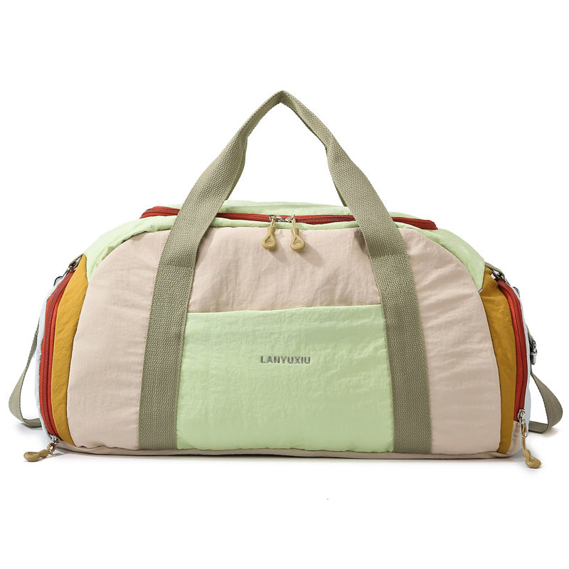 Unisex compact sports duffle bag showing side profile and zipper pocket