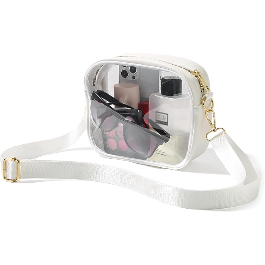 White transparent crossbody bag filled with daily essentials and adjustable strap