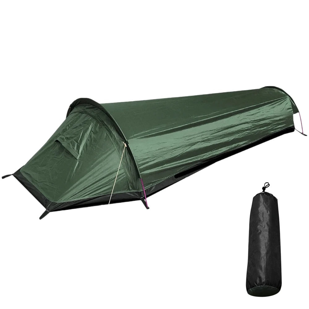 Green 1-person ultralight waterproof camping tent set up outdoors with carrying bag