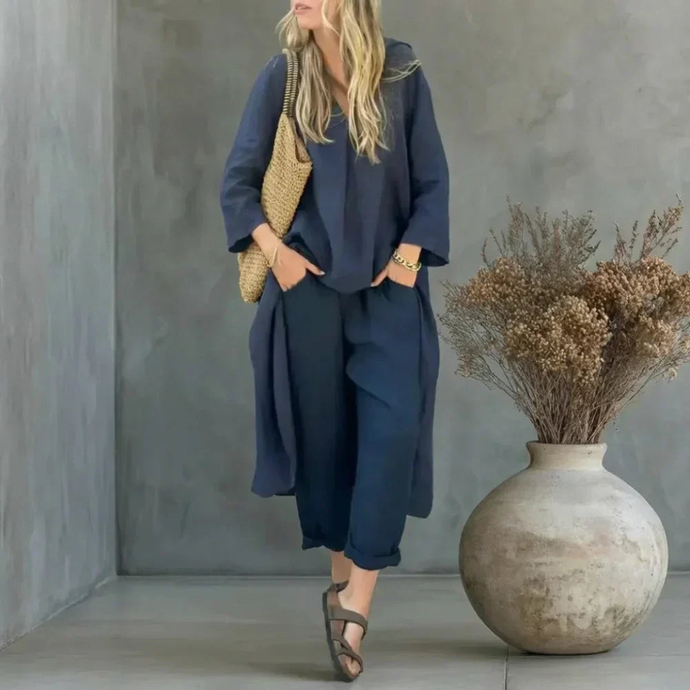 Woman wearing a navy blue relaxed long vest and wide-leg pants set