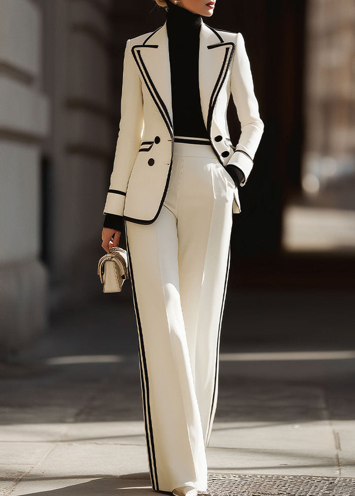 Close-up view of the structured blazer and high-waisted wide-leg trousers