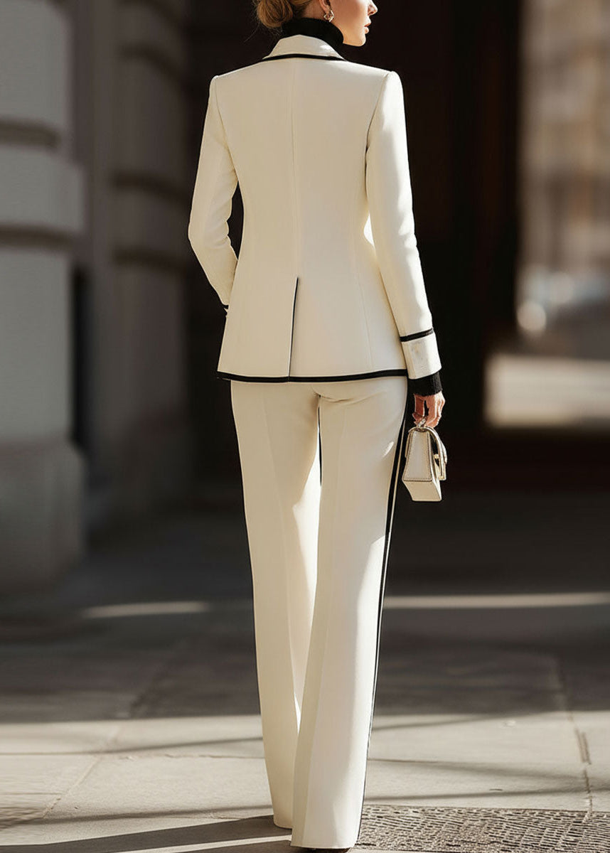 Formal business attire set featuring a contrast trim blazer and wide leg trousers