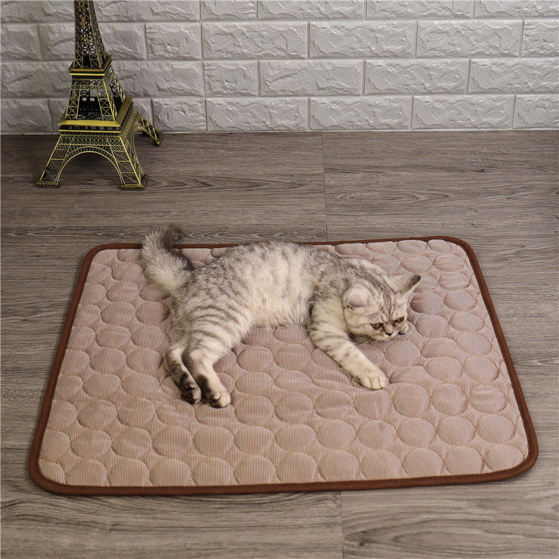 Small dog relaxing peacefully on soft blue cat cooling bed