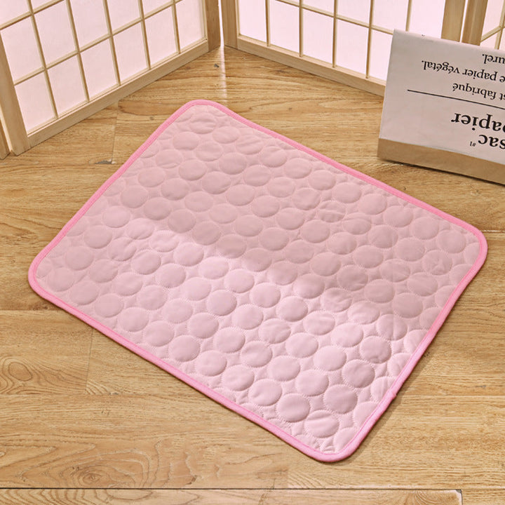 Cat resting comfortably on a pressure activated pet cooling pad