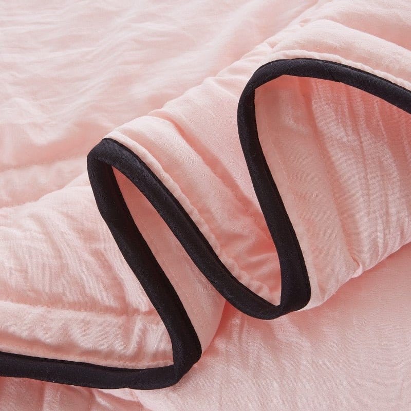 Folded cool touch blanket showcasing soft home textiles
