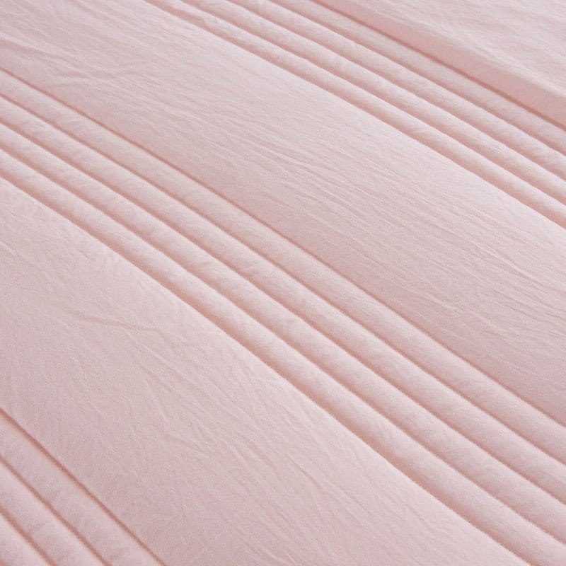 Person relaxing under a breathable blanket for ultimate sleep comfort