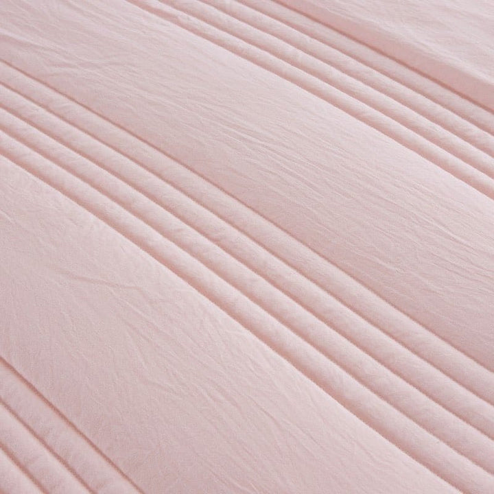 Person relaxing under a breathable blanket for ultimate sleep comfort