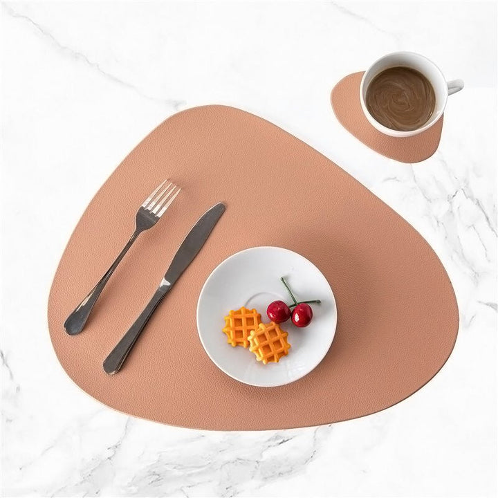 Pink modern table placemat and coaster set on white marble with small white plate and cup