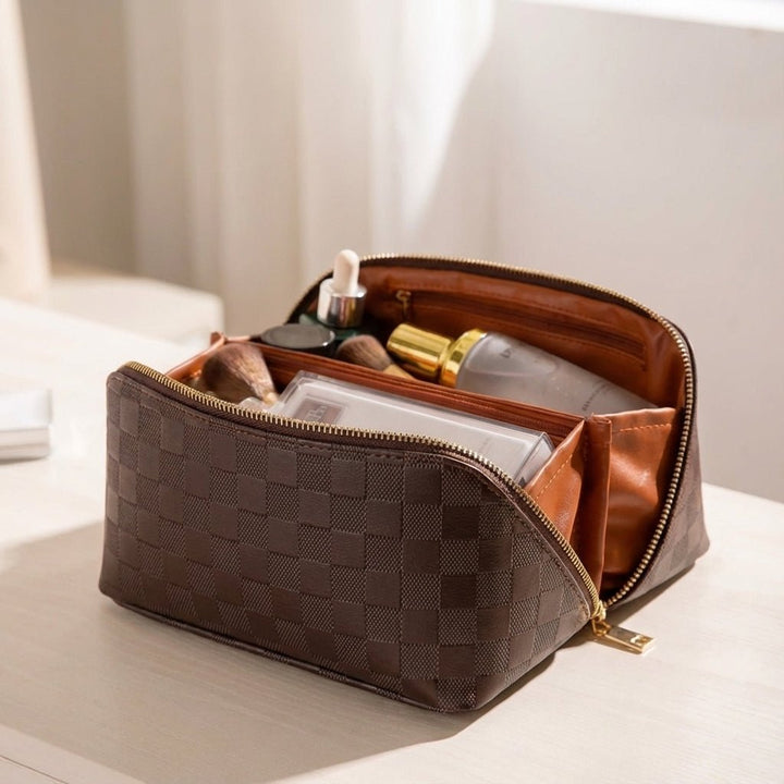 Brown travel toiletry bag and makeup storage case showing spacious interior layout