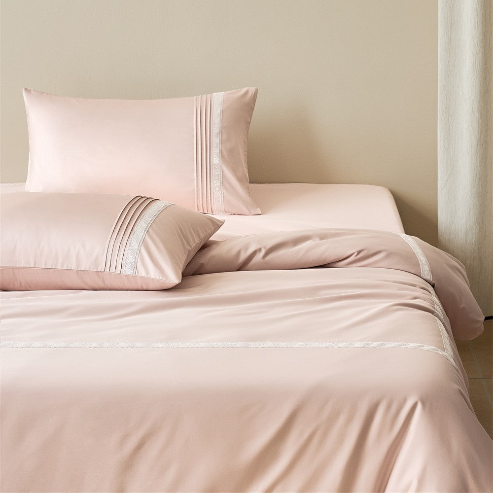 Soft pink luxury bedding set with decorative lace border