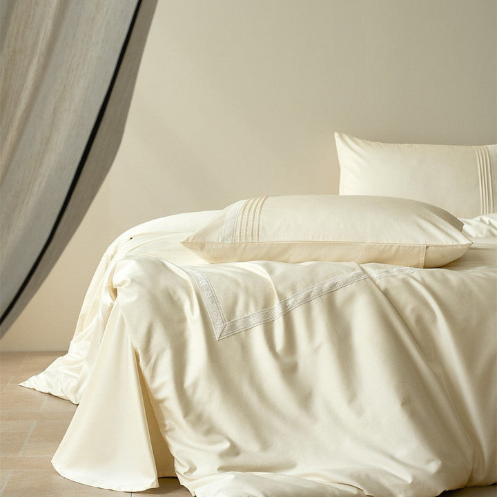 Close-up of premium lace trim on luxury white bedding set