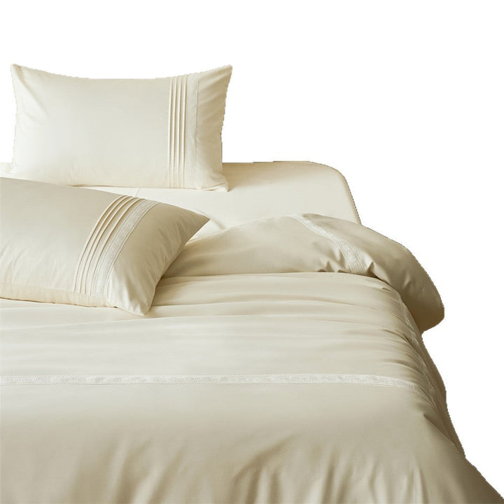 Complete luxury bedding set styled neatly on a modern bed