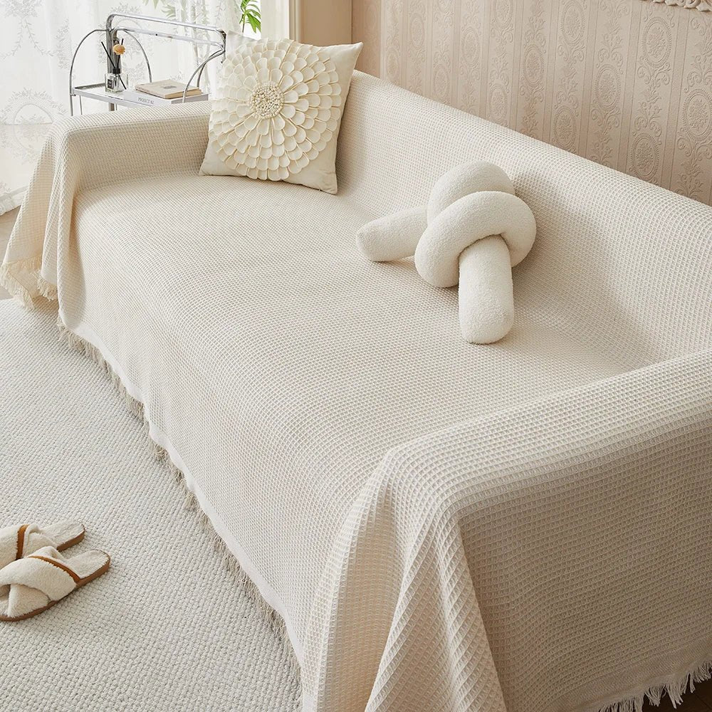Close-up view of the textured beige sofa protection cover