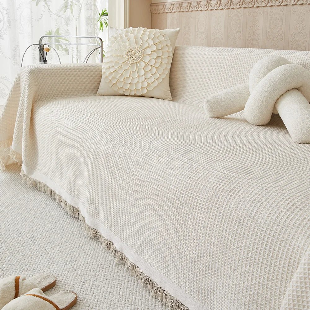 Washable beige sofa slipcover protecting furniture in a modern living room