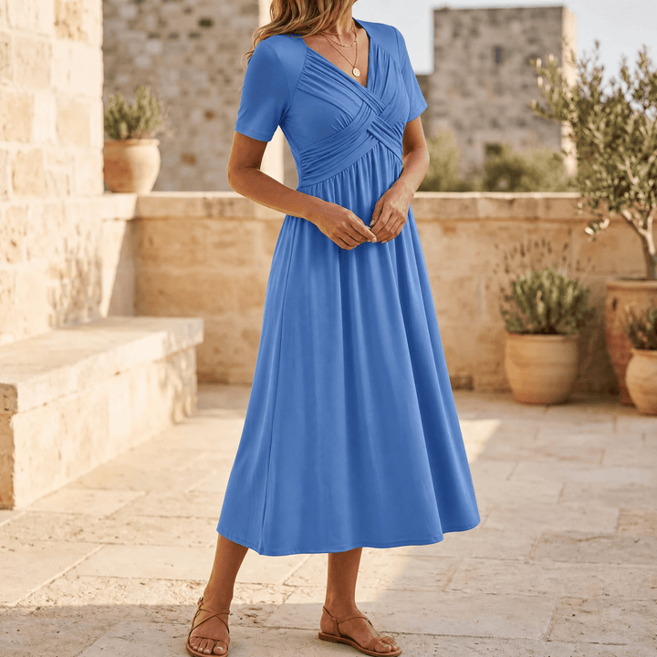 Model wearing powder blue crossover v-neck midi dress