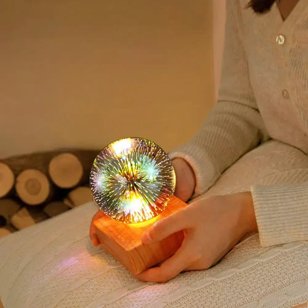 Person holding the illuminated 3D crystal ball night light