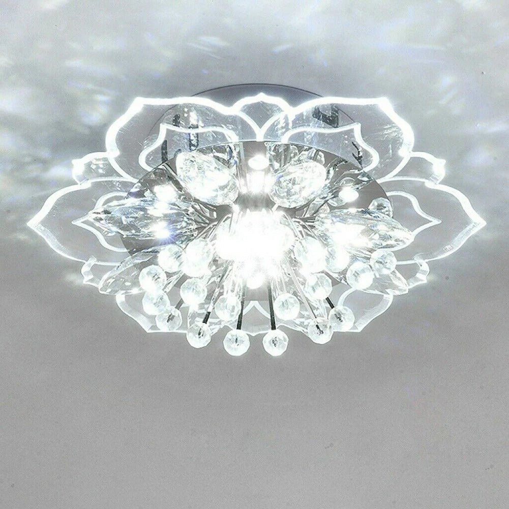 Close-up view of the glittering crystal petals and gold accents on the ceiling light