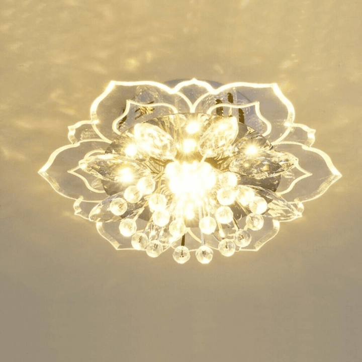Close up of gold accent lighting details on the modern crystal LED flower ceiling fixture