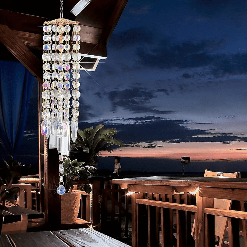 Close-up of sparkling crystal prisms on a decorative hanging wind chime for patio