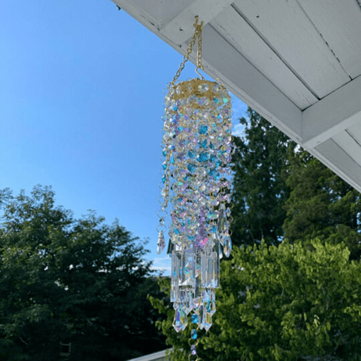 Hanging crystal sun catcher and wind chime enhancing tranquil backyard space