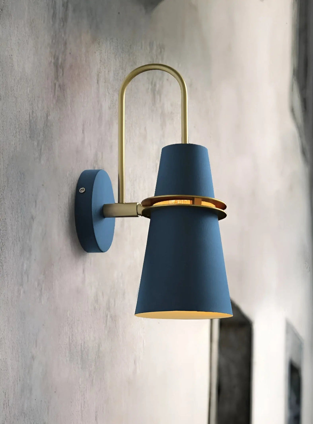 Blue modern LED wall lamp mounted on a textured grey wall
