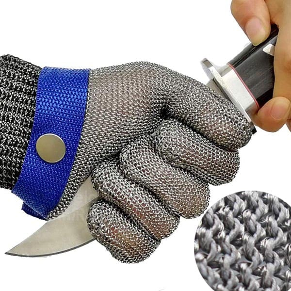 Close-up of cut resistant glove testing protection against a sharp knife blade