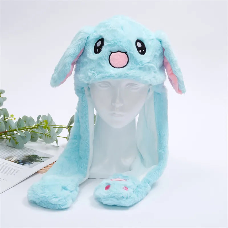 Blue rabbit plush moving ear hat displayed on a mannequin head
