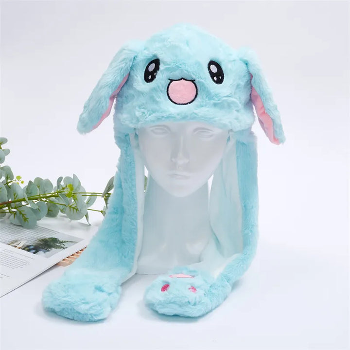 Blue rabbit plush moving ear hat displayed on a mannequin head