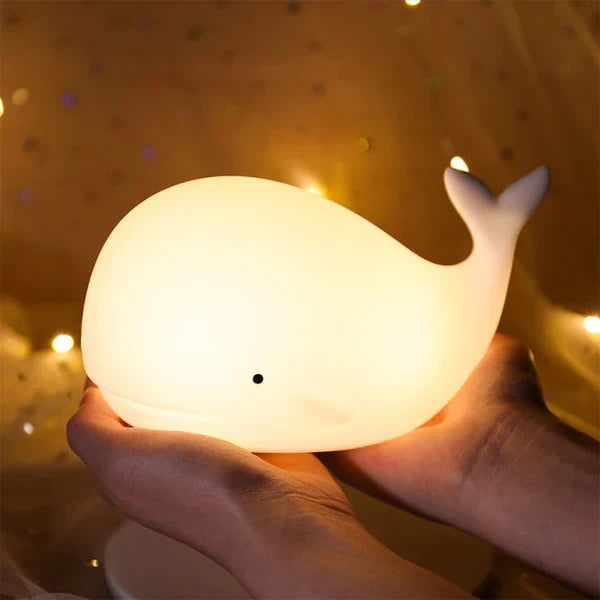 Cute whale night light for kids room presented in product packaging