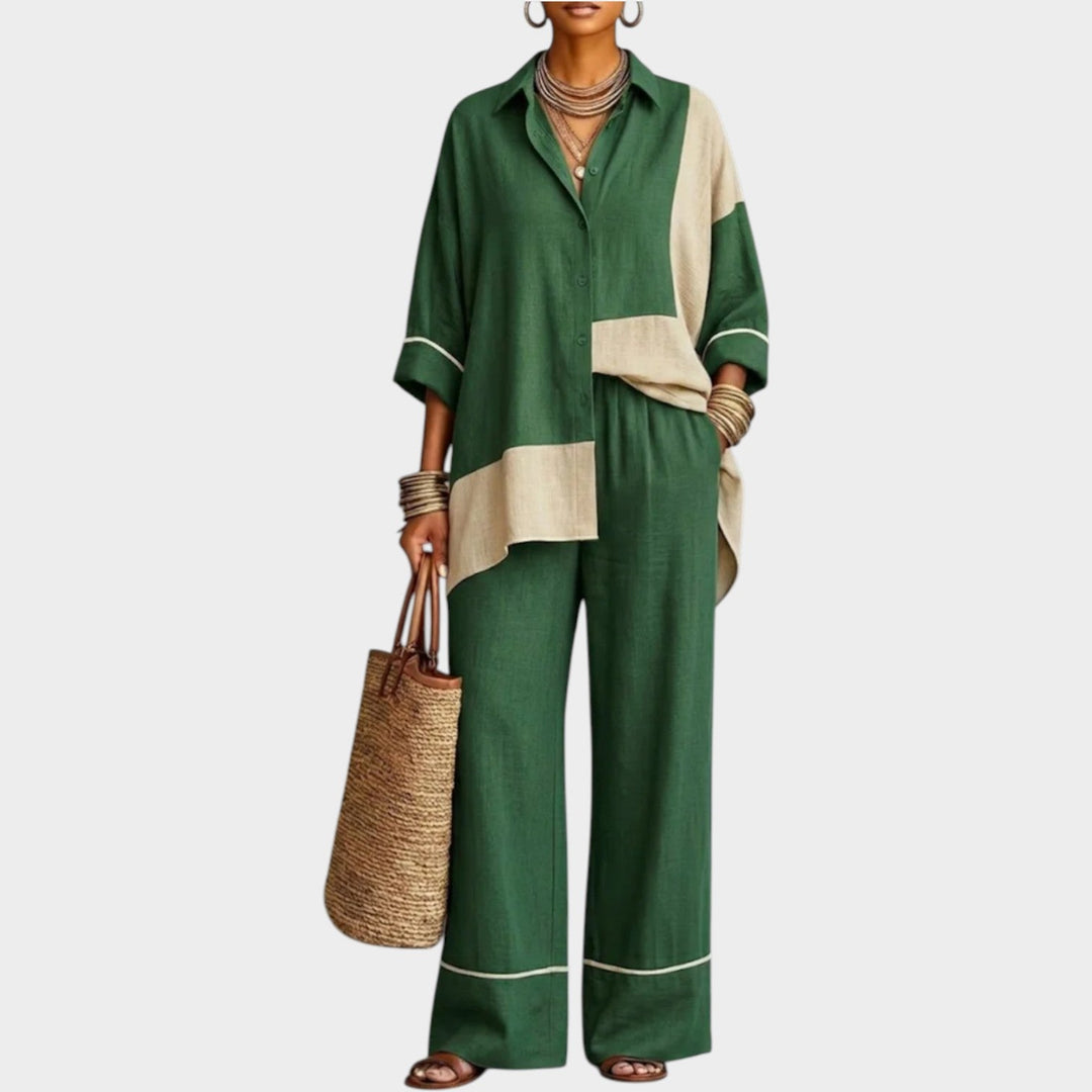 Front view of a woman wearing a green and beige color block two-piece matching set with wide-leg pants.