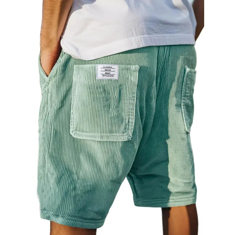 Detailed view of waistband and button closure on mens apparel shorts