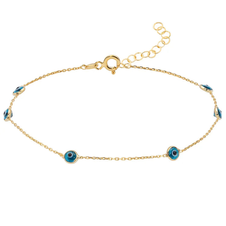 Gold evil eye anklet displayed flat on a clean background