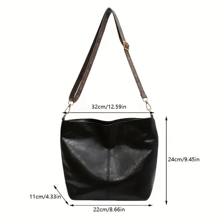 Product dimension diagram showing width 32 cm, height 24 cm, and depth 11 cm on a black bag