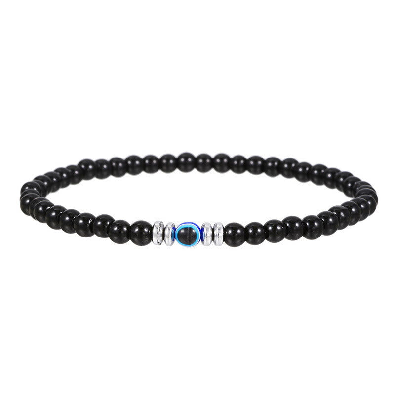 Mens natural stone evil eye beaded bracelet closeup view on wrist