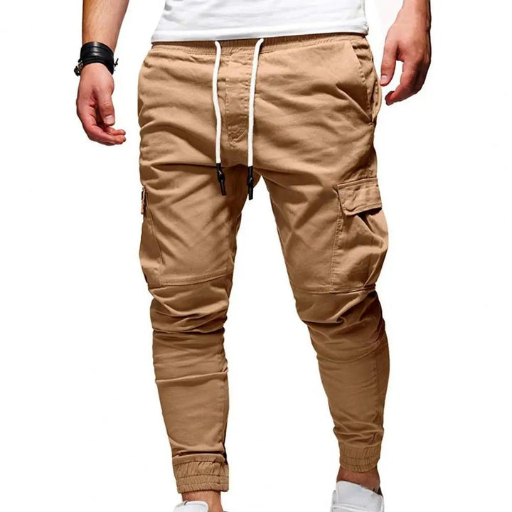 Side profile of men's stretch cargo pants showing utility pockets