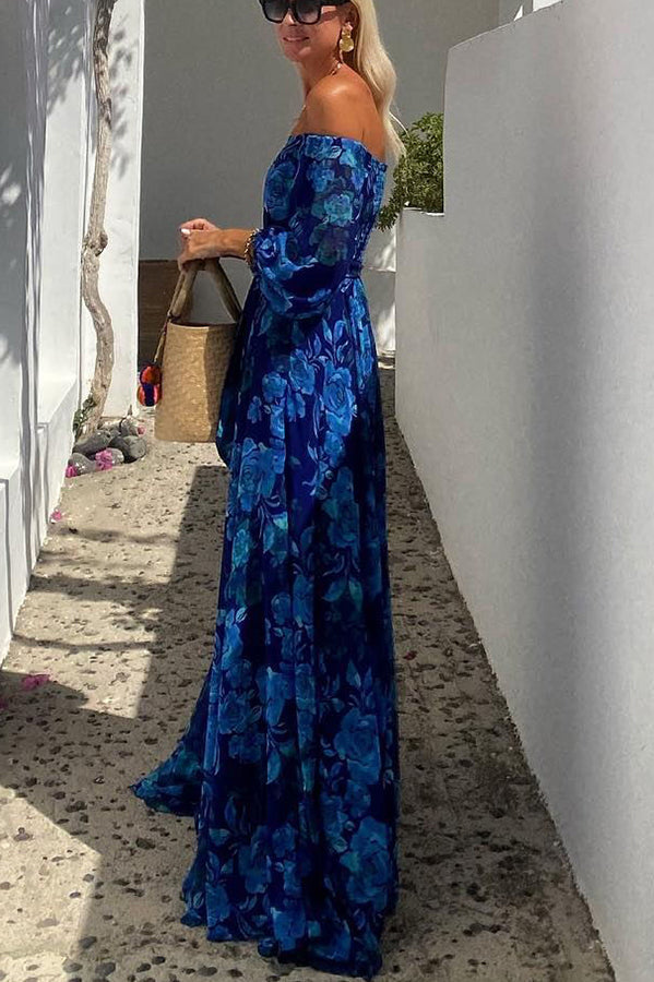 Side profile view of woman standing in the blue floral maxi dress