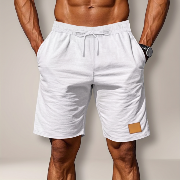 Flat lay of mens drawstring casual shorts showcasing lightweight summer fabric